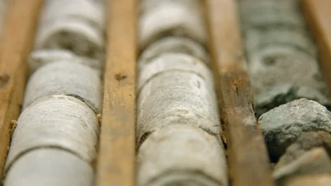 Sedimentary rock core samples from geological borehole in wooden box Video stock 123803594