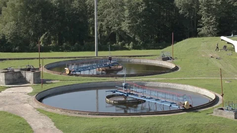 Sedimentation basin, sewage flowing through large tanks. Stock Footage 102392411