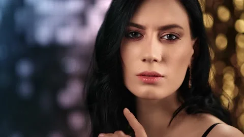 Seductive Asian lady with bright makeup making silence gesture. Close up shot on Stock Footage 150688098