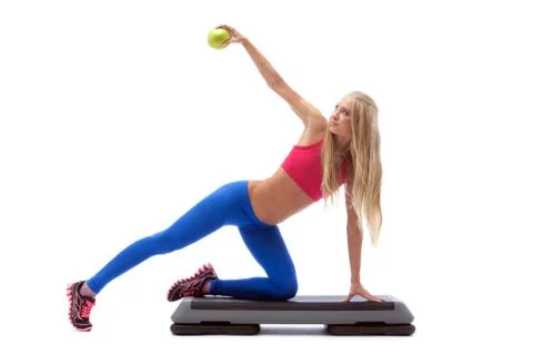 Seductive cute model exercising on stepper Stock Photos