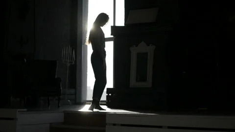 Seductive girl's silhouette is dancing Stock Footage 86592659