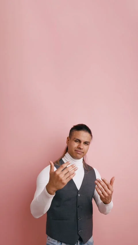 Seductive Latino man inviting with gestures and winking. Vertical Stock Footage 333074339