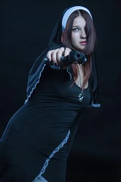 Seductive nun with gun Stock Photos