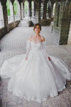 Seductive young bride posing on the territory of country hotel Stock Photos