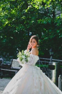 Seductive young bride posing on the territory of country hotel Stock Photos