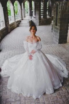 Seductive young bride posing on the territory of country hotel Stock Photos