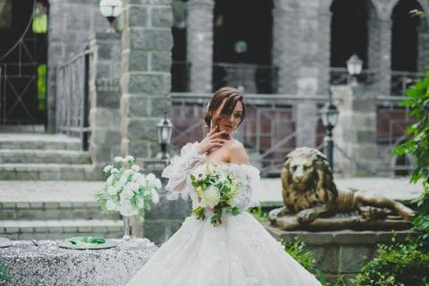 Seductive young bride posing on the territory of country hotel Stock Photos
