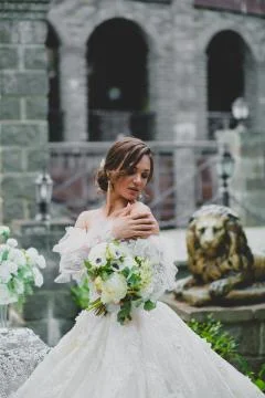 Seductive young bride posing on the territory of country hotel Stock Photos