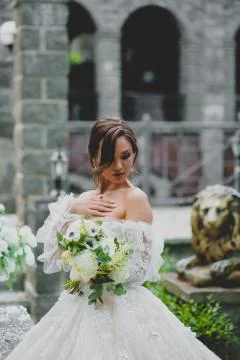 Seductive young bride posing on the territory of country hotel Stock Photos