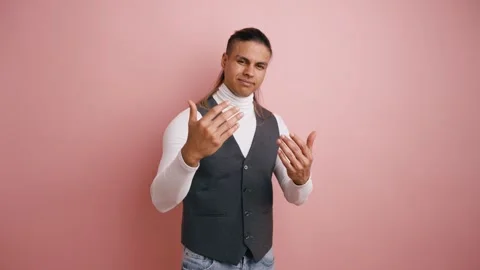 Seductive young man inviting someone to come closer with a gesture Stock Footage 335275094