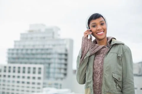 Seductive young model in winter clothes calling someone with her mobile phone Stock Photos