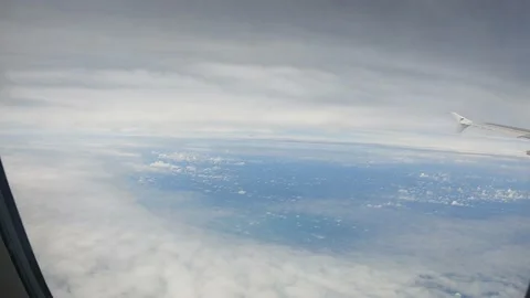 See the clouds behind the plane window Stock Footage 232345519