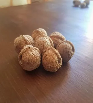 See walnut seeds on a table Stock Photos