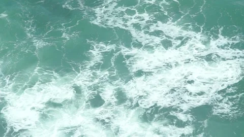 See the waves on the beach from the cliff Stock Footage 295472425