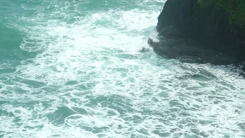 See the waves on the beach from the cliff Stock Footage 295472426