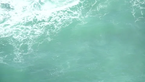 See the waves on the beach from the cliff Stock Footage 295472465