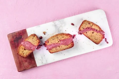 A seed cake with ruby chocolate, shot from the top on a pink background wi... Stock Photos