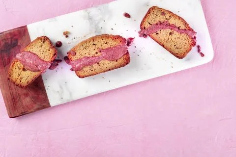 A seed cake with ruby chocolate, shot from above on a pink background with Stock Photos