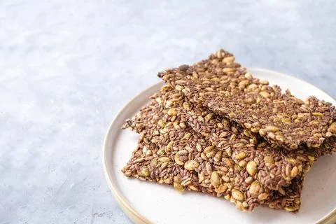 Seed crackers on neutral background Photos