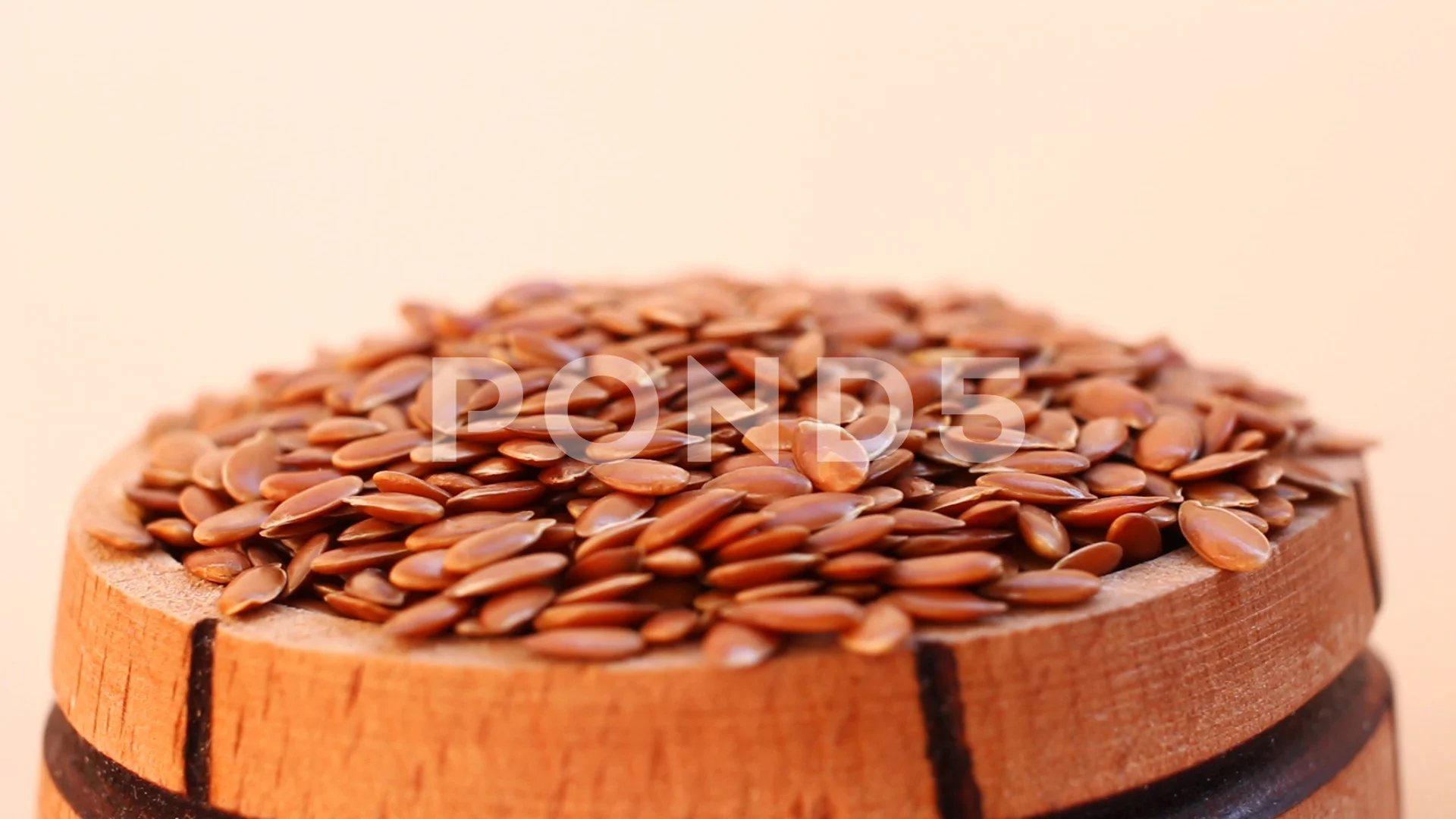 https://images.pond5.com/seed-flax-barrel-close-footage-105917346_prevstill.jpeg