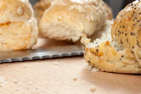 Seeded bread rolls laying on a kitchen worktop Stock Photos