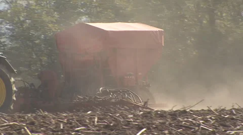 Seeder raises dust while sowing corn Stock-Footage 36992768