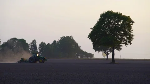 Seeder sower machine implement cereal grain seeds in field soil. Air balloon Stock Footage 116954187