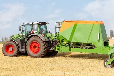 The seeder as a trailed unit on a tractor provides excellent soil preparation Stock Photos