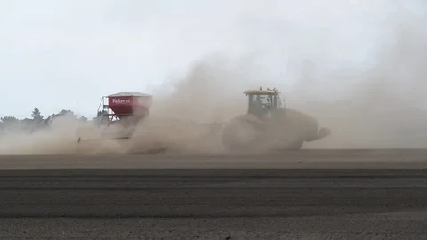 Seeding machine working in field ellerton yorkshire united kingdom Stock Footage 78057480