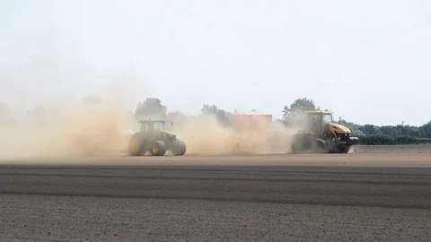 Seeding machine working in field ellerton yorkshire united kingdom Stock Footage 78057953
