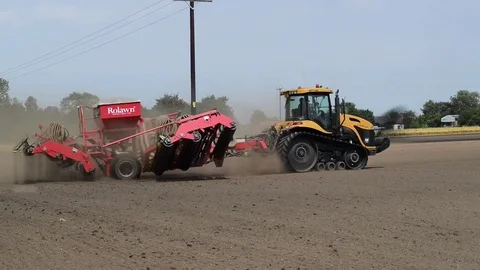 Seeding machine working in field ellerton yorkshire united kingdom Stock Footage 78058076