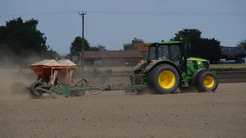 Seeding machine working in field ellerton yorkshire united kingdom Stock Footage