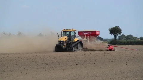 Seeding machine working in field ellerton yorkshire united kingdom Stock Footage 78059606