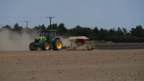 Seeding machine working in field ellerton yorkshire united kingdom Stock Footage 78060001