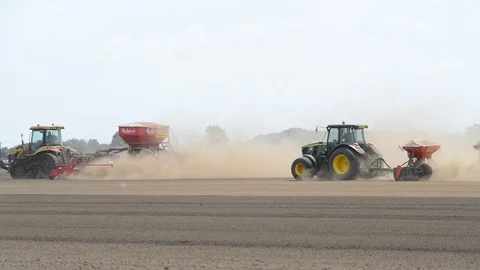 Seeding machine working in field ellerton yorkshire united kingdom Stock Footage 78060268