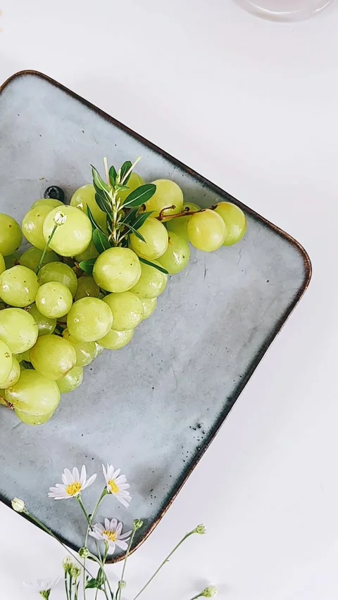 Seedless green grapes, plate, table setting, gorgeous, flowers, Stock Footage 278490785