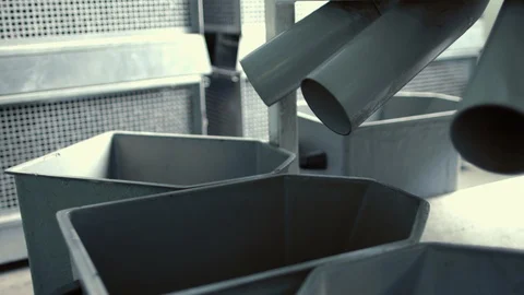Seeds fall from conveyor into boxes after cleaning process. Industrial workshop Stock Footage 107177504