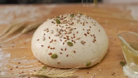 Seeds Falling On Dough Stock-Footage 273501154