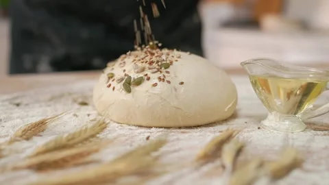 Seeds Falling On Raw Dough Stock Footage 273501158