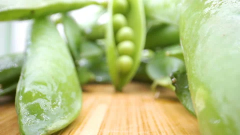 The seeds inside the green beans on the table Stock Footage 135700684