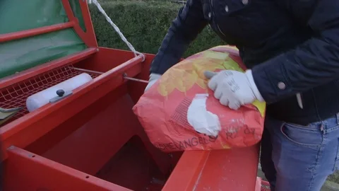 Seeds loading in a seeder machine Stock Footage 113289929