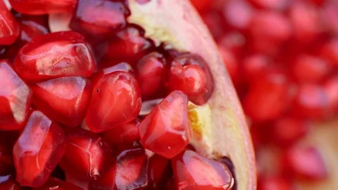 Seeds of a pomegranate that is red like a ruby ​​that can be eaten Stock Footage 119787112