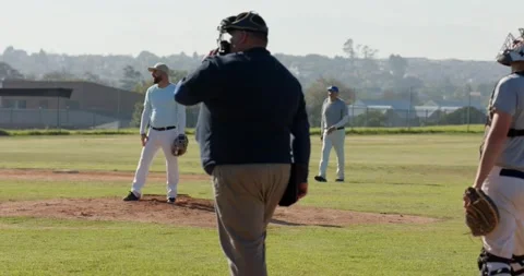 Seeing batter holding bat, pitcher on mound winding, throwing pitch, catcher 스톡 동영상 335069402