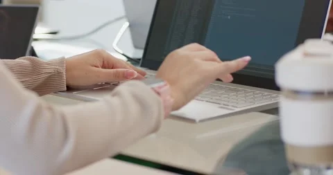 Seeing code editor, female coder typing, tapping touchpad at desk, pointing at Stock Footage 335836343