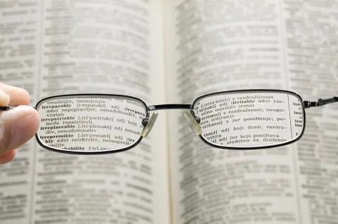 Seeing dictionary through glasses Stock Photos