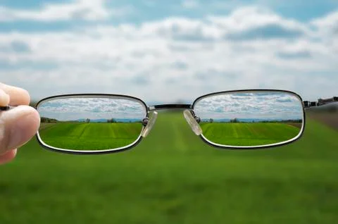 Seeing landscape through glasses Stock Photos