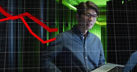 Seeing red graph appearing, man in shirt and specs checking laptop data in green Stock Footage 331757281