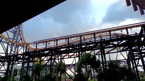 Seeing the roller coaster from below in a mall Stock Footage 218976080