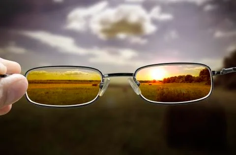 Seeing sunset through glasses Stock Photos