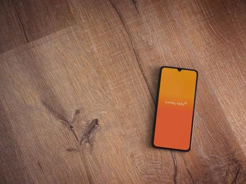 Seeking Alpha app launch screen with logo on the display of a black mobile sm Stock Photos